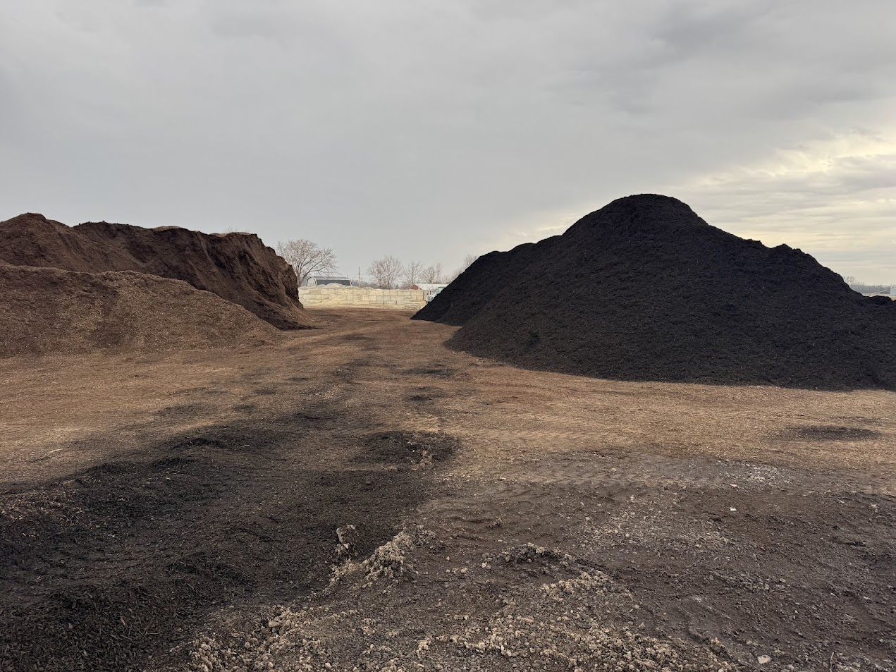 Two large bulk material piles at the Lammon Bros yard in Delta
