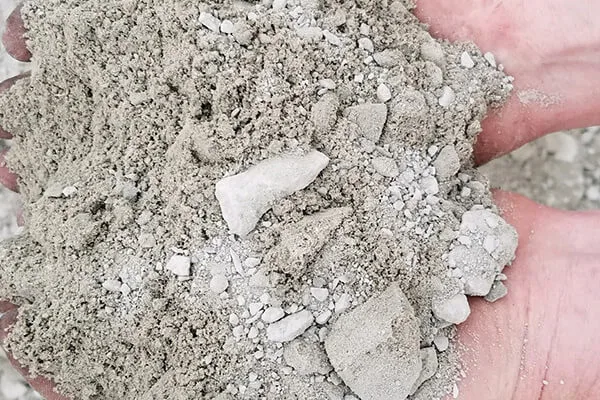 Handful of crushed Limestone #411 with fines
