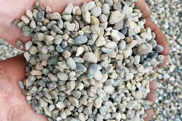 Handful of rounded multicolored pea gravel